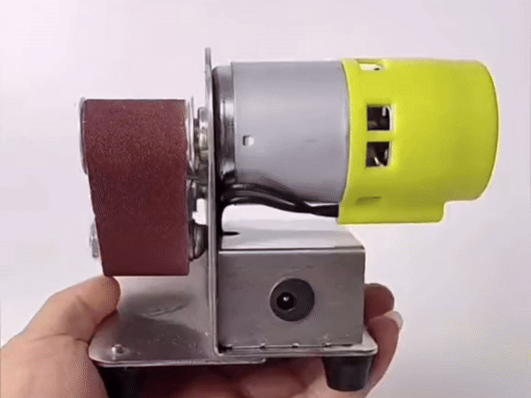 Type 25 mini belt sander with yellow polishing wheel, power supply, and belts.