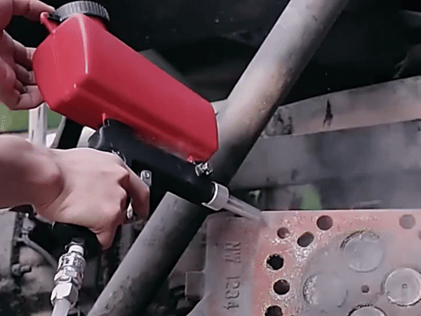 Close-up of a sandblaster adjustment knob for precise abrasive media flow control