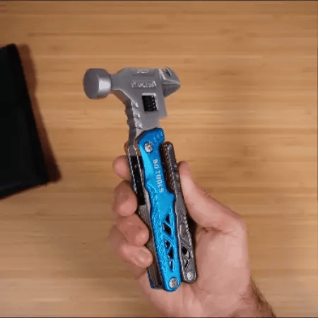 Close-up of a silver multifunctional wrench hammer with a precise laser scale