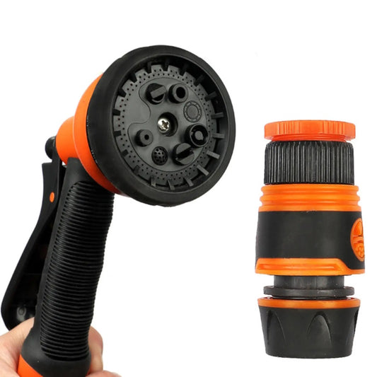 Close-up of an orange 7-pattern garden spray gun and quick-connect hose adapter.