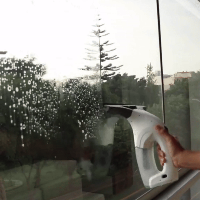 Cleaning a glass shower door with Taskrafter™ cordless vacuum for a streak-free shine