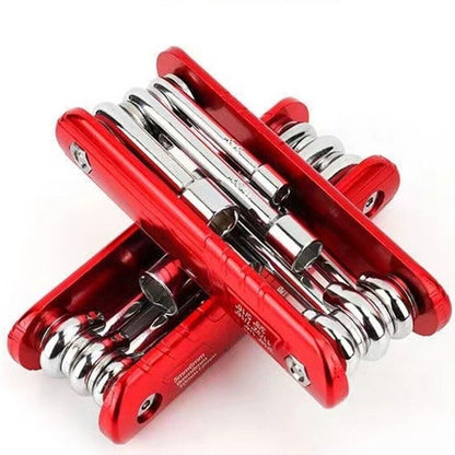 Hand holding a 6-in-1 folding socket wrench for outdoor bicycle maintenance
